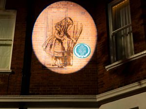 Supporting image for story: Plaque for Alice In Wonderland illustrator reinstalled after 65 years in storage