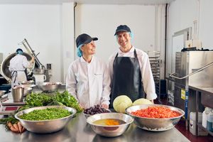 Different Dog's Alex and Charlie in the kitchen.
