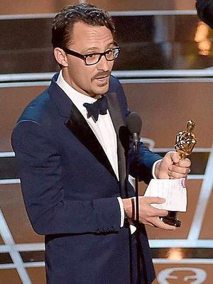 Writer-director Mat Kirkby collecting his Oscar