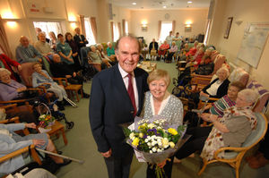 Sylvia Harland receives a presentation from chairman Derek Tremayne at Newport Cottage Care Centre