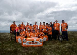 The Mini Up A Mountain team with the constructed MINI at the summit.