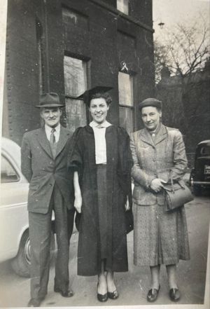 Gwen with her parents on graduation day