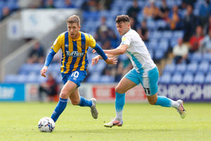 Josh Vela of Shrewsbury Town and Jonny Smith of Burton Albion. (AMA)