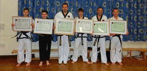 Bridgnorth Ta Kwon-Do members Luke Richardson, Daniel Muir, Gary Plant, Jake Round, Aubrey Round and Robert Hall show off the spoils of their success after securing black belt promotions.
