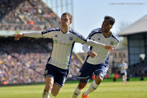 Craig Gardner of West Bromwich Albion celebrates after scoring a goal to make it 0-2 with Joleon Lescott.