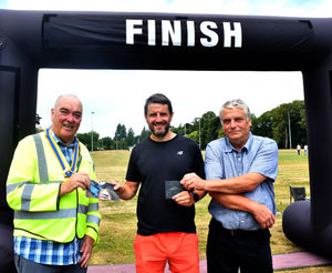 Winner in the Open 40-49 age category - Matthew Evans with Hugh Garner of Builth Wells Rotary - helped sponsor event and provided volunteers on the day and Deputy Mayor Councillor Alan Waller. Image by Ted Edwards Photography