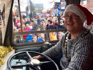 Oswestry's mayor takes the wheel of the Derwen College float 