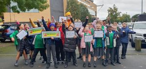 Youngsters from Long Knowle Primary School cheer on Manny as he continues his fundraising walk