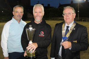 Woore skipper Gary Beff flanked by Colin Beaman of sponsors KGJ County President Simon Fullard