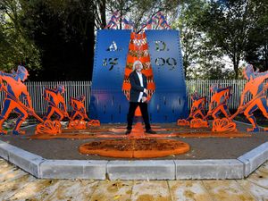 The sculpture commemorating Abraham Darby, with sculptor Steve Field, near his birthplace in Dudley