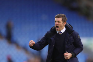 Sam Ricketts the head coach / manager of Shrewsbury Town celebrates winning the game at full time.
