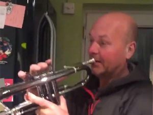 Supporting image for story: K-pop fans make dad go viral after he plays trumpet to BTS song