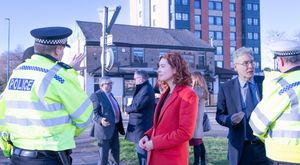 Sarah Coombes MP speaking with a police officer. 