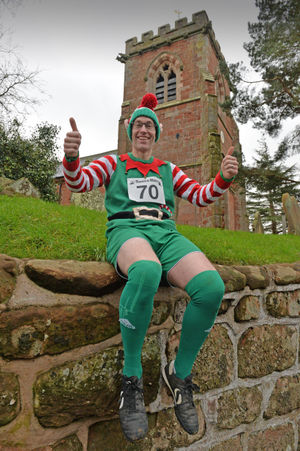  Pictured, vicar Chris Precious gets involved in the Kinnerley fun run