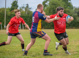 Ludlow hooker Jack Small fends off a Clee Hill defender during Saturday's Cow Cup victory Picture: Trevor Patchett