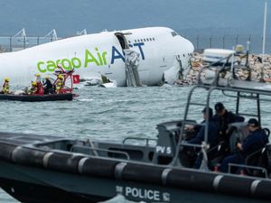 Supporting image for story: Two killed after plane falls into sea off Hong Kong runway