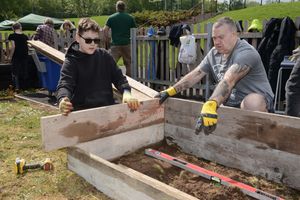 Pupils, staff and volunteers help to create the outdoor classroom 