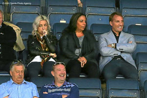 Liverpool boss Brendan Rodgers, right, watches his son Anton playing for Oldham Athletic