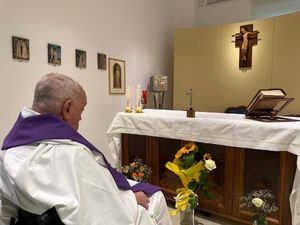 Pope Francis in a wheelchair celebrating a Mass inside a hospital chapel