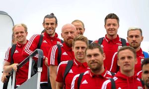 Dave Edwards, centre, behind Sam Vokes and in front of Wayne Hennessey, with superstars Gareth Bale, left, and Aaron Ramsey, right