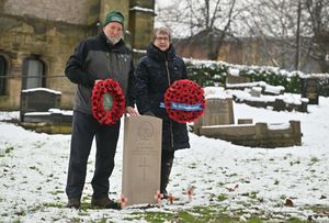 John Nicholls of the Commonwealth War Graves Commission and Catherine Robottom of St James's Church with the new headstone in honour of Lance-Corporal Alfred Nicholls