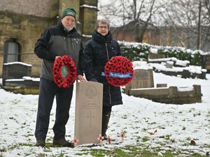 John Nicholls of the Commonwealth War Graves Commission and Catherine Robottom of St James's Church with the new headstone in honour of Lance-Corporal Alfred Nicholls