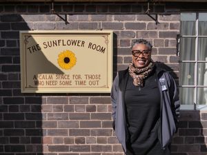 IGMT Community Engagement and DEI Manager, Andrea Nelson, in front of the Sunflower Room at Blists Hill Victorian Town