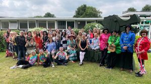 Staff at Whitehouse Common Primary School in 60s gear 