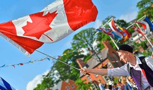 Flying the flag high for Canada during the parade
