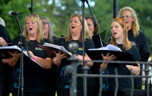 Oswestry Balloon Carnival in the town centre.  The Peoples Show Choir..