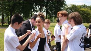 Wolgarston High School Students signing shirts