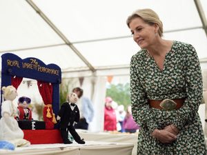 Supporting image for story: Sophie examines knitted versions of herself and husband at flower show