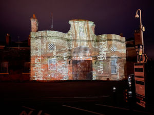 The projection of the names of the men who were arrested or killed in the Cinderloo uprising. Photo: Andrew Howe