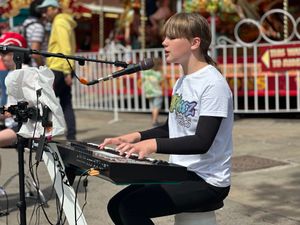Juno, performing as part of The SCARKEEZ, singing and playing keyboard.
