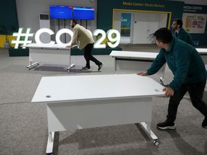 Desks are moved at the Cop29 UN Climate Summit