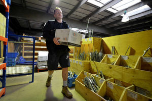 Tom's job is to look after the stock and make sure parts are available