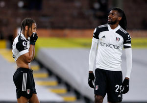 Fulham's Andre-Frank Zambo Anguissa (right) and Bobby Decordova-Reid appear dejected