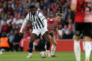 Cedric Kipre on the ball for Albion (Photo by Adam Fradgley/West Bromwich Albion FC via Getty Images).