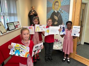 Supporting image for story: Primary school children take action after murals at refugee centre painted over