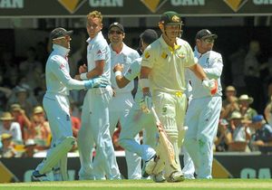 England's Stuart Broad (second left) celebrates taking the wicket of Australia's David Warner (second right)