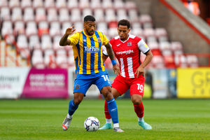 David Davis of Shrewsbury Town and Sam Nombe of Exeter City. (AMA)