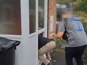 Supporting image for story: Watch police break down door in drugs raid before seizing weapons and removing man