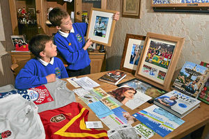 Pupils Callum Binnersley, left, with his brother Scott  and a selection of the lots on offer