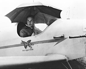 August 1966: 'Keeping the rain off the joy stick is Mr R S Voice of the Tiger Club who took part in the Goodyear Air Trophy Race at Bobbington.' 