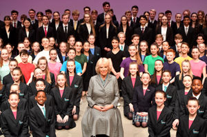 The Duchess of Cornwall poses onstage with pupils during a visit to Elmhurst Ballet School in Birmingham