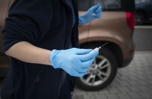 File photo dated 26/09/20 of a nurse preparing flu vaccine jabs at one of the new the drive-thru flu clinics at Little France, Edinburgh. Children and pregnant women in England will start receiving flu vaccinations from Monday - with school immunisat