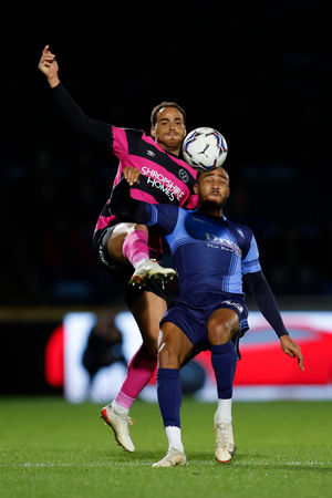 Elliott Bennett of Shrewsbury Town and Jordan Obita of Wycombe Wanderers (AMA)