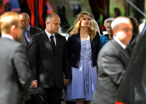 Father and daughter Peter and Lydia Wilkinson outside the church