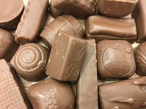 Supporting image for story: Roses or Quality Street: Can you match the unwrapped chocolate to the chocolate box?