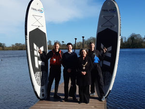 Owners of The Paddle Bros, Chris Harris (far left) and Tim Harris (far right) celebrate moving to The Mere in Ellesmere with Mark Hooper (project leader, Visit Shropshire|) and The Mayor of Ellesmere, Councillor Liz Woodbridge. Picture: LDRS